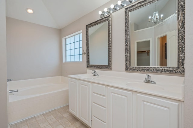 715 Presscott St, Crestview, FL 32536 - bathroom featuring a chandelier, a garden tub, double vanity, and lofted ceiling