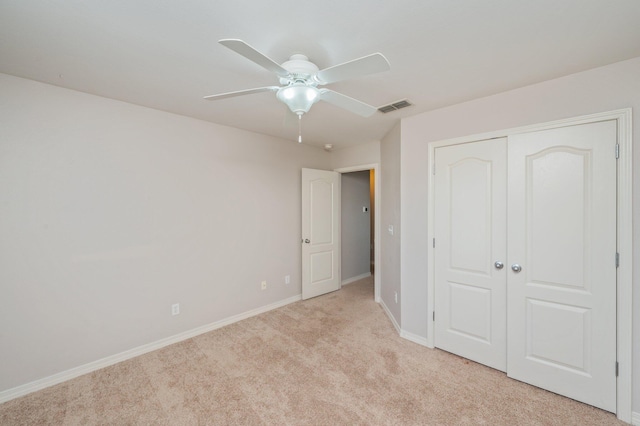 715 Presscott St, Crestview, FL 32536 - unfurnished bedroom with light colored carpet, a closet, and ceiling fan