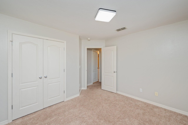715 Presscott St, Crestview, FL 32536 - unfurnished bedroom featuring light carpet and a closet