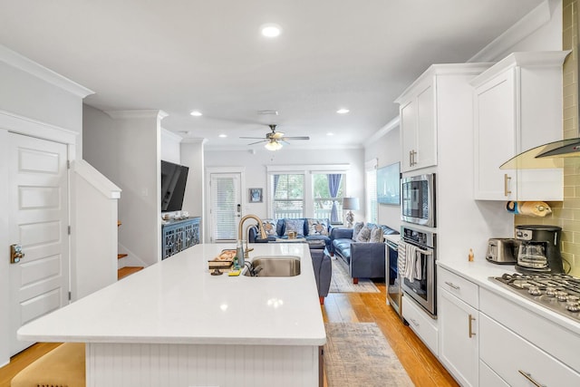 386 Grande Pointe Cir, Inlet Beach, FL 32461 - kitchen with appliances with stainless steel finishes, ventilation hood, open floor plan, crown molding, and light countertops