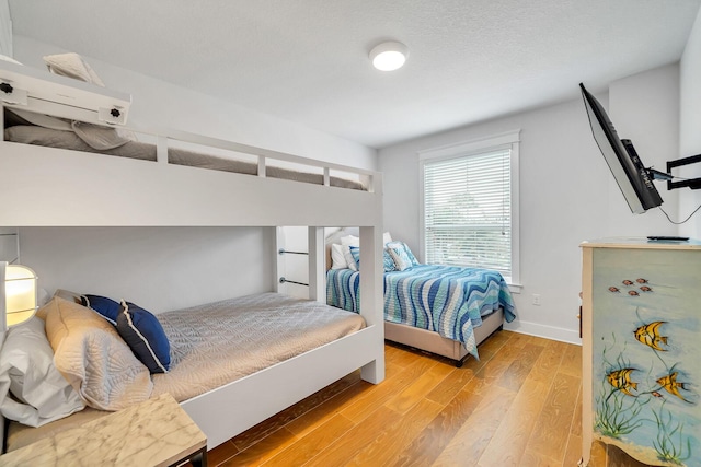 386 Grande Pointe Cir, Inlet Beach, FL 32461 - bedroom with light wood-style floors and an AC wall unit