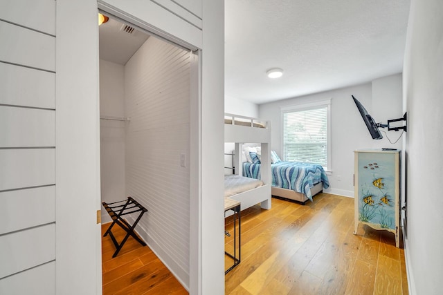 386 Grande Pointe Cir, Inlet Beach, FL 32461 - bedroom featuring hardwood / wood-style floors and baseboards
