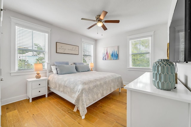 386 Grande Pointe Cir, Inlet Beach, FL 32461 - bedroom with light wood finished floors and a ceiling fan