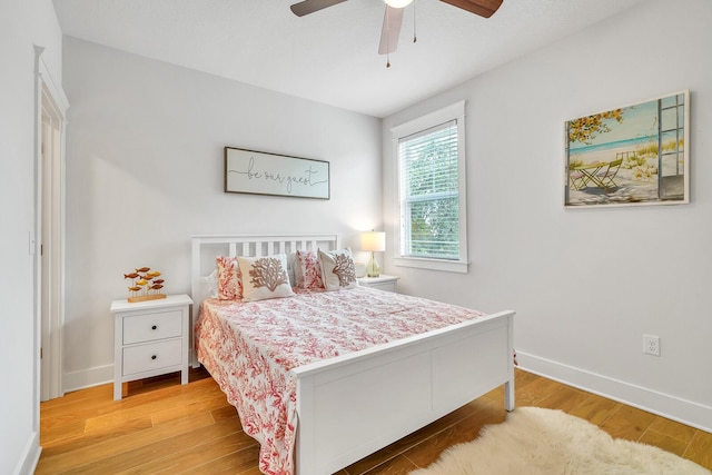 386 Grande Pointe Cir, Inlet Beach, FL 32461 - bedroom with wood finished floors and a ceiling fan