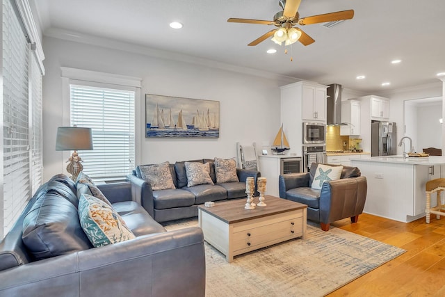 386 Grande Pointe Cir, Inlet Beach, FL 32461 - living area with light wood finished floors, ceiling fan, crown molding, recessed lighting, and beverage cooler