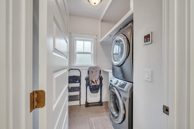 386 Grande Pointe Cir, Inlet Beach, FL 32461 - laundry room with stacked washer / dryer and tile patterned flooring