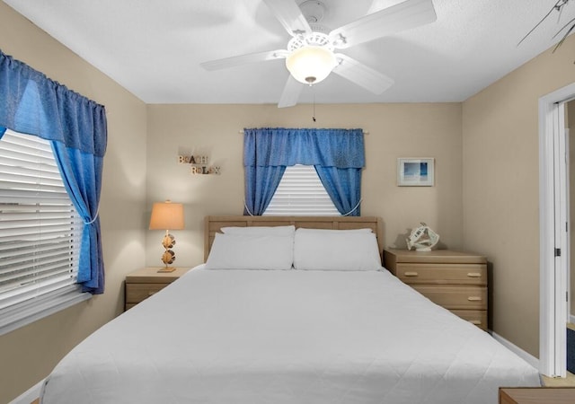 2396 Scenic Gulf Dr Unit 210, Miramar Beach, FL 32550 - bedroom featuring ceiling fan and multiple windows