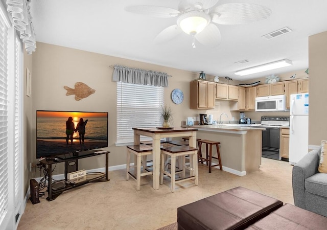 2396 Scenic Gulf Dr Unit 210, Miramar Beach, FL 32550 - living area featuring a ceiling fan and baseboards