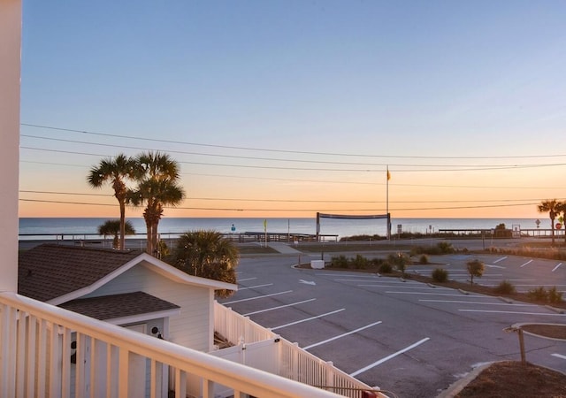 2396 Scenic Gulf Dr Unit 210, Miramar Beach, FL 32550 - parking at dusk with uncovered parking and a water view