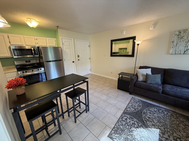 200 Sandestin Ln Unit 612, Miramar Beach, FL 32550 - living room with light tile patterned floors and a textured ceiling