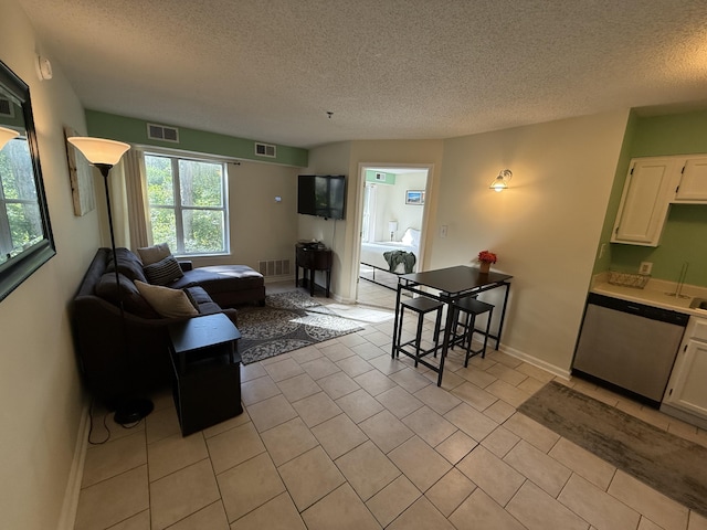 200 Sandestin Ln Unit 612, Miramar Beach, FL 32550 - living area featuring a textured ceiling and light tile patterned floors