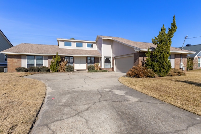 702 Beachcomber Dr, Lynn Haven, FL 32444 - mid-century inspired home with brick siding, driveway, a garage, and a front yard