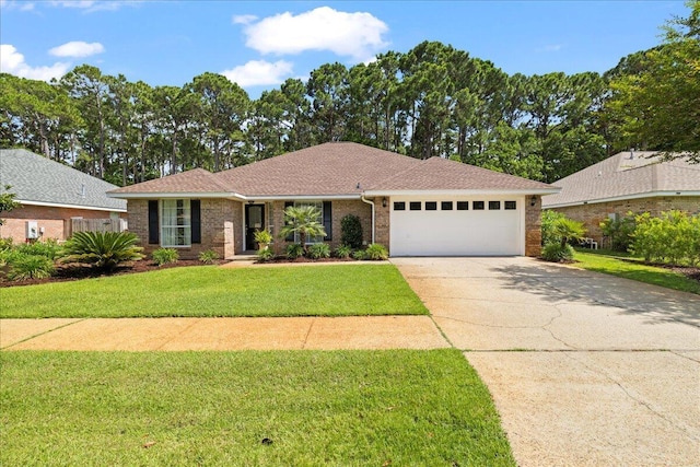 3928 Mesa Rd, Destin, FL 32541 - single story home with an attached garage, driveway, a front lawn, brick siding, and a shingled roof