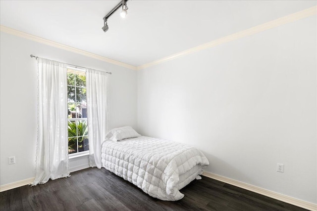 3928 Mesa Rd, Destin, FL 32541 - bedroom with dark wood-style floors, ornamental molding, and track lighting