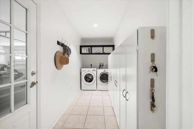 3928 Mesa Rd, Destin, FL 32541 - laundry room featuring separate washer and dryer, crown molding, and light tile patterned floors