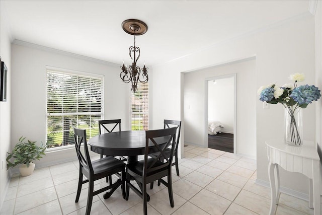 3928 Mesa Rd, Destin, FL 32541 - dining space featuring crown molding, light tile patterned floors, and a chandelier