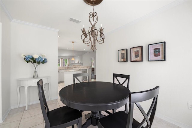 3928 Mesa Rd, Destin, FL 32541 - dining space with ornamental molding, a chandelier, and light tile patterned floors