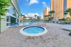17757 Front Beach Rd Unit 507, Panama City Beach, FL 32413 - community pool featuring a community hot tub and a patio area