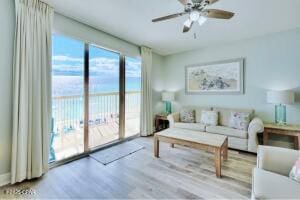 17757 Front Beach Rd Unit 507, Panama City Beach, FL 32413 - living area with wood finished floors and ceiling fan