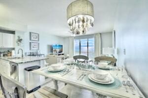 17757 Front Beach Rd Unit 507, Panama City Beach, FL 32413 - dining space featuring a chandelier