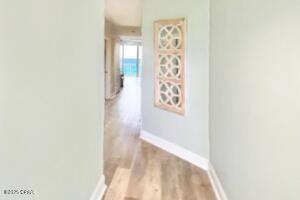 17757 Front Beach Rd Unit 507, Panama City Beach, FL 32413 - corridor with light wood finished floors and baseboards