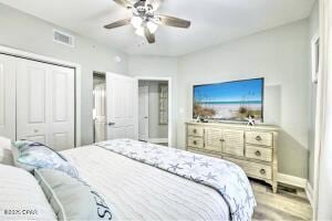 17757 Front Beach Rd Unit 507, Panama City Beach, FL 32413 - bedroom featuring wood finished floors, a closet, and a ceiling fan