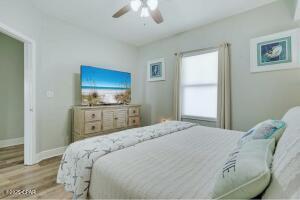 17757 Front Beach Rd Unit 507, Panama City Beach, FL 32413 - bedroom featuring wood finished floors and ceiling fan