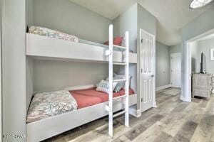 17757 Front Beach Rd Unit 507, Panama City Beach, FL 32413 - bedroom featuring wood finished floors and baseboards