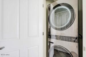 17757 Front Beach Rd Unit 507, Panama City Beach, FL 32413 - washroom featuring stacked washing machine and dryer