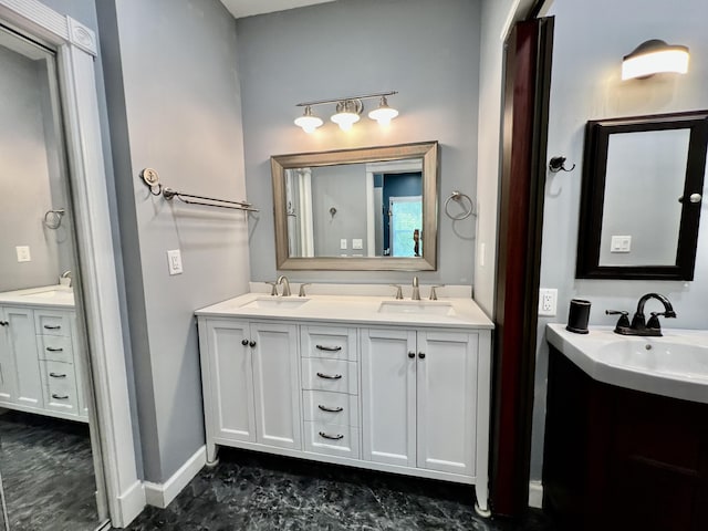 226 N Marsh Lndg, Freeport, FL 32439 - full bathroom with two vanities and baseboards
