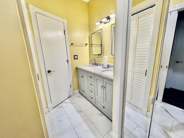 226 N Marsh Lndg, Freeport, FL 32439 - full bathroom featuring marble look tiles, double vanity, and a closet