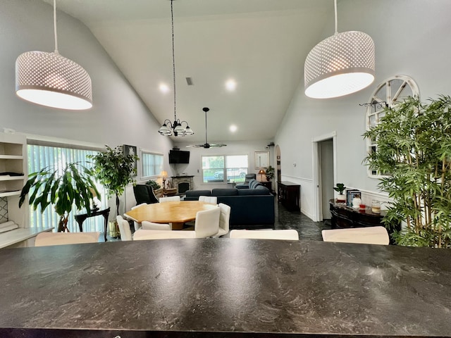 226 N Marsh Lndg, Freeport, FL 32439 - dining area featuring high vaulted ceiling and a fireplace