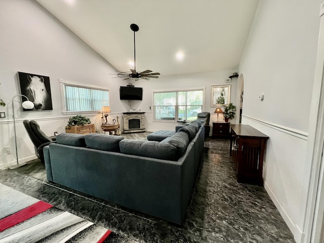 226 N Marsh Lndg, Freeport, FL 32439 - living area with ceiling fan, a stone fireplace, arched walkways, and high vaulted ceiling