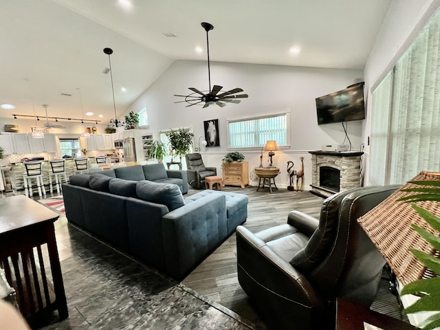 226 N Marsh Lndg, Freeport, FL 32439 - living area featuring ceiling fan, high vaulted ceiling, a stone fireplace, and recessed lighting