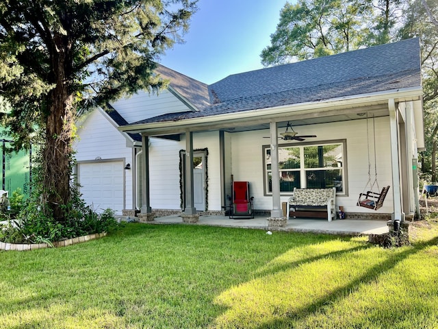 226 N Marsh Lndg, Freeport, FL 32439 - view of front of property featuring an attached garage, a front yard, covered porch, a shingled roof, and ceiling fan