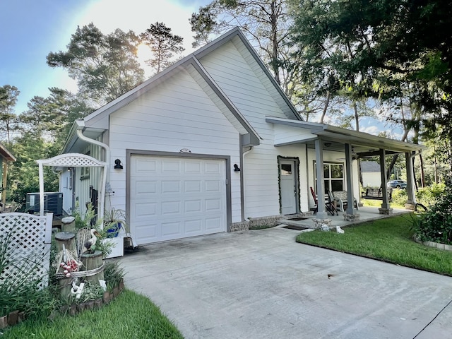 226 N Marsh Lndg, Freeport, FL 32439 - view of front of home with driveway, a garage, and covered porch