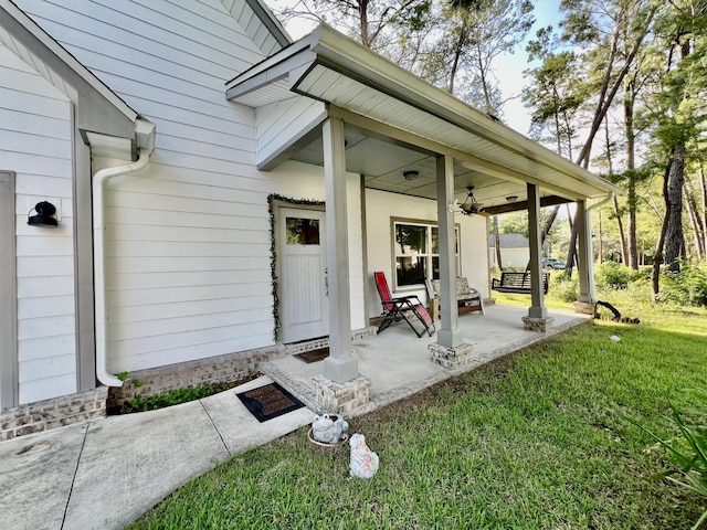 226 N Marsh Lndg, Freeport, FL 32439 - doorway to property with a yard, a porch, and ceiling fan