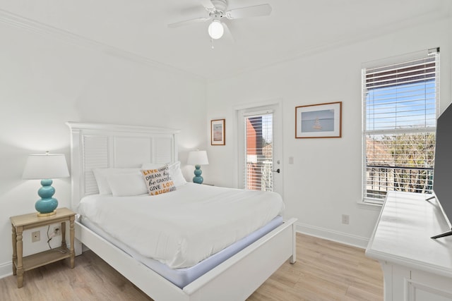 256 Kono Way, Destin, FL 32541 - bedroom with access to exterior, light wood-type flooring, multiple windows, and crown molding