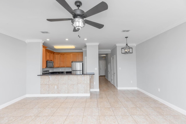 289 Mattie M Kelly Blvd, Destin, FL 32541 - kitchen featuring appliances with stainless steel finishes, crown molding, a ceiling fan, recessed lighting, and brown cabinetry