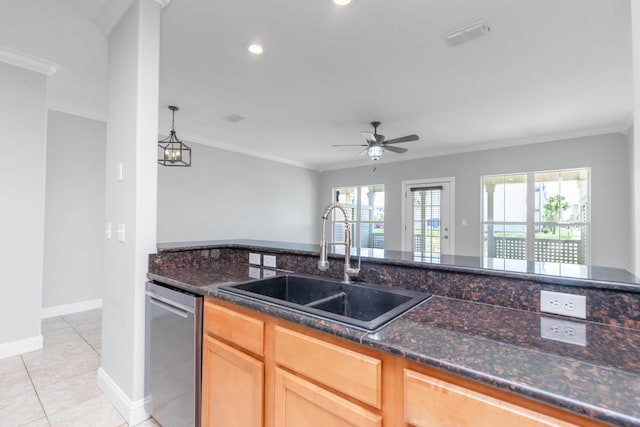 289 Mattie M Kelly Blvd, Destin, FL 32541 - kitchen featuring stainless steel dishwasher, dark stone countertops, ceiling fan, crown molding, and light tile patterned floors