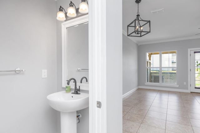 289 Mattie M Kelly Blvd, Destin, FL 32541 - bathroom with a chandelier, crown molding, and tile patterned floors