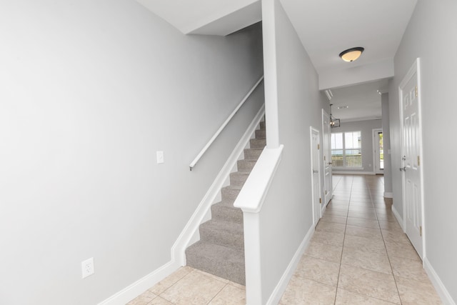 289 Mattie M Kelly Blvd, Destin, FL 32541 - stairway with tile patterned floors and baseboards