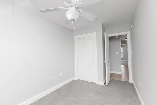 289 Mattie M Kelly Blvd, Destin, FL 32541 - unfurnished bedroom featuring a closet, carpet floors, and ceiling fan