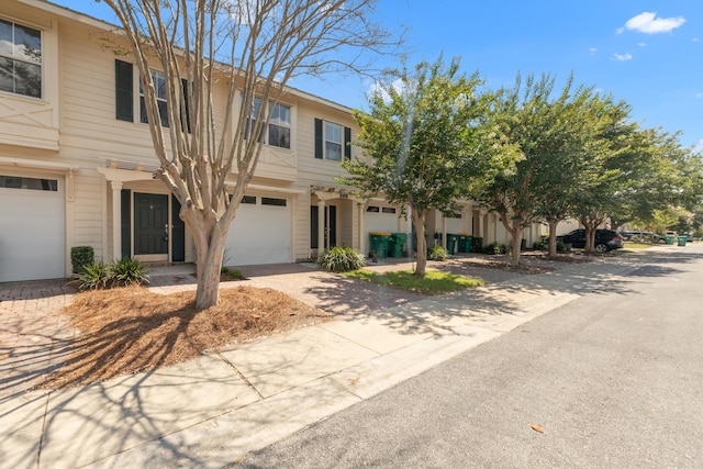 289 Mattie M Kelly Blvd, Destin, FL 32541 - townhome / multi-family property with an attached garage and driveway