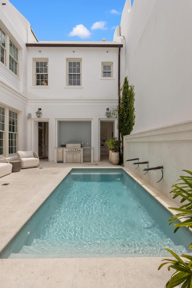 40 Silver Sea Ct Unit Aa4, Inlet Beach, FL 32461 - back of property featuring exterior kitchen, a patio, an outdoor pool, and stucco siding