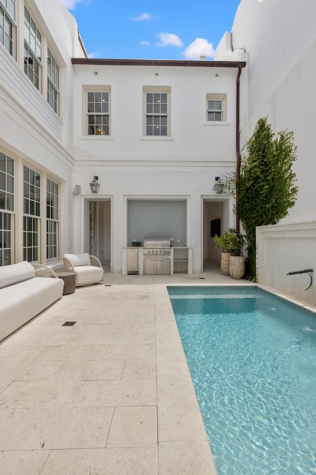 40 Silver Sea Ct Unit Aa4, Inlet Beach, FL 32461 - back of property with exterior kitchen, a patio area, an outdoor pool, and stucco siding