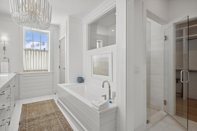 40 Silver Sea Ct Unit Aa4, Inlet Beach, FL 32461 - full bath with a shower stall, a bath, a chandelier, vanity, and tile patterned floors
