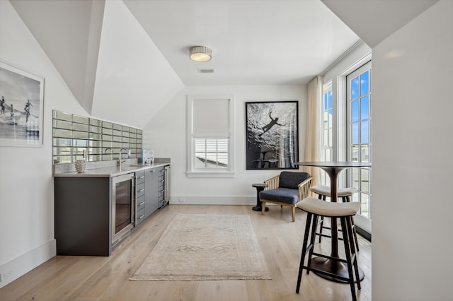 40 Silver Sea Ct Unit Aa4, Inlet Beach, FL 32461 - indoor bar with beverage cooler, light wood finished floors, and decorative backsplash