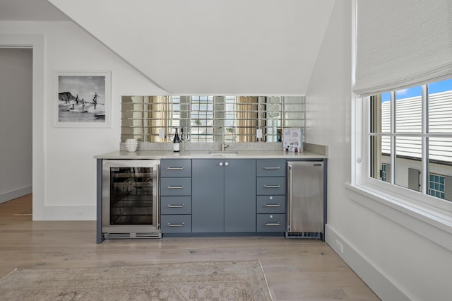 40 Silver Sea Ct Unit Aa4, Inlet Beach, FL 32461 - indoor wet bar featuring beverage cooler, light wood-style floors, stainless steel refrigerator, and lofted ceiling