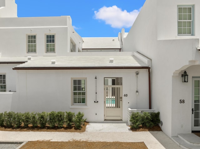 40 Silver Sea Ct Unit Aa4, Inlet Beach, FL 32461 - view of exterior entry featuring stucco siding